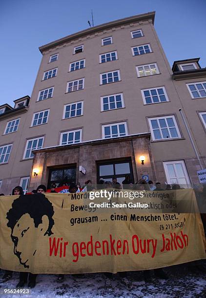 Protesters carrying a banner that reads: "We Commemorate Oury Jalloh" block the entrance to the main police station during a demonstration marking...