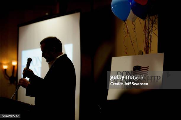 Senate Republican primary candidate Don Blankenship replaces the microphone after addressing supporters following a poor showing in the polls May 8,...