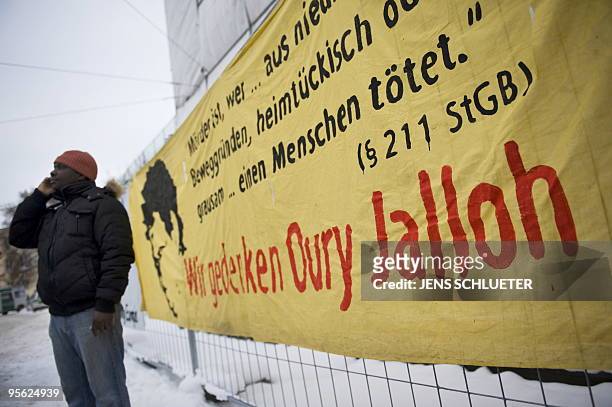 Protesters have hung up a banner which reads "In Rememberance of Oury Jalloh" during a demonstration in the eastern German city of Dessau on January...
