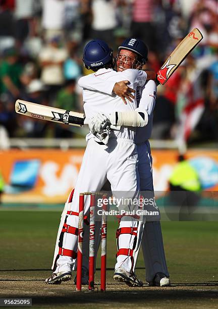 Graeme Swann of England celebrates with Graham Onions of England after England drew the match against South Africa during day five of the third test...