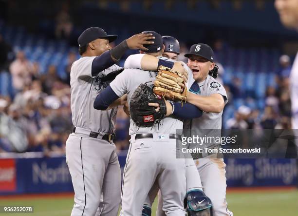 James Paxton of the Seattle Mariners is congratulated by teammates Jean Segura, Mike Zunino and Kyle Seager after throwing a no-hitter during MLB...