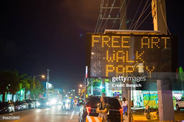 sign advertises art walk in wynwood miami usa - wynwood stock pictures, royalty-free photos & images