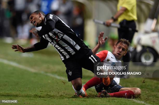 Romulo Otero of Brazil's Atletico Mineiro, is fouled by Robert Ayrton Piris da Motta of Argentina's San Lorenzo, during their Copa Sudamericana...