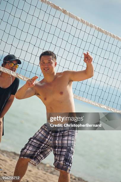 beach volleyball - board shorts stock pictures, royalty-free photos & images