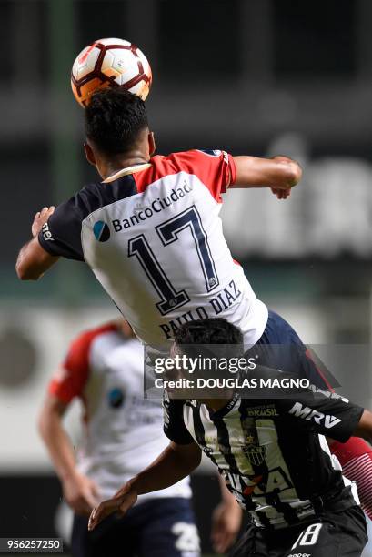 Paulo Diaz of Argentina's San Lorenzo heads the ball over Erik of Brazil's Atletico Mineiro, during their Copa Sudamericana football tournament match...