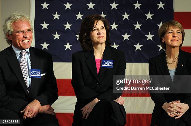 Democratic Senate nominee and Massachusetts Attorney General Martha Coakley sits with Joseph P. Kennedy and Vicki Kennedy while receiving an...