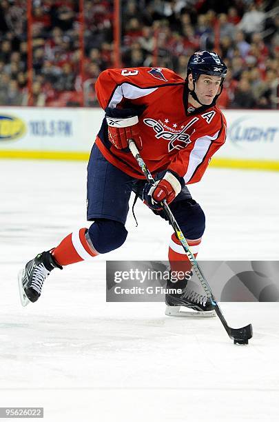 Tom Poti of the Washington Capitals handles the puck against the Montreal Canadiens at the Verizon Center on January 5, 2010 in Washington, DC.