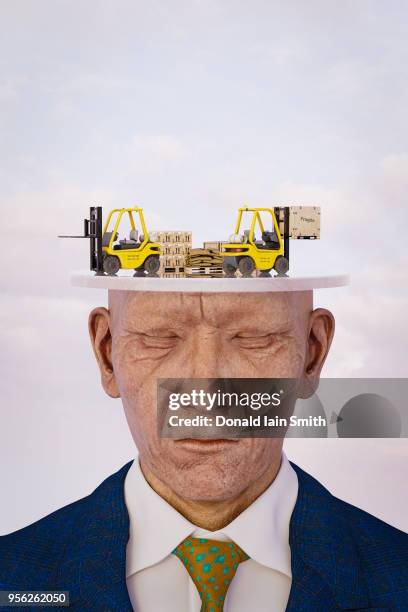 business man with eyes closed and distribution warehouse in his mind - dream deliveries stock pictures, royalty-free photos & images