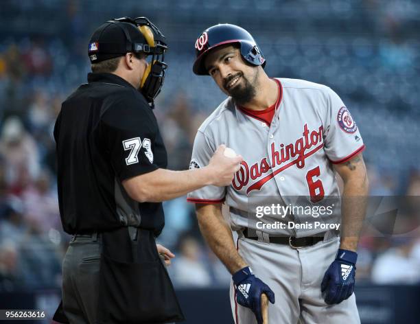 Anthony Rendon of the Washington Nationals talks with umpire Tripp Gibson after a called strike out during the first inning of a baseball game...