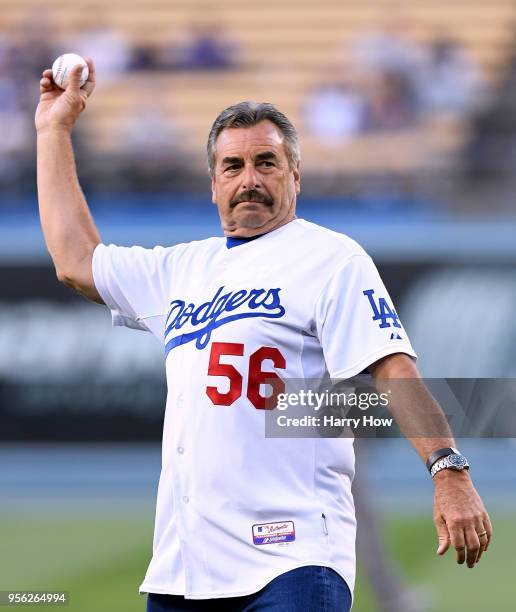 Los Angeles Police Chief Charlie Beck, throws out a ceremonial first pitch before the game between the Arizona Diamondbacks and the Los Angeles...