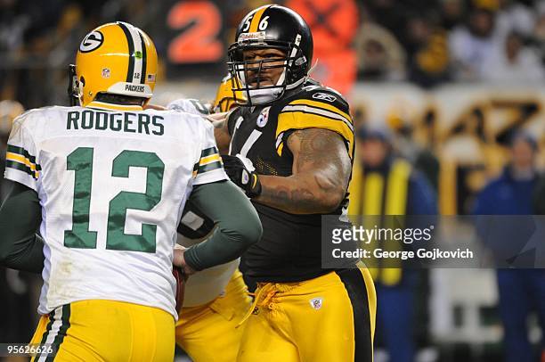 Linebacker LaMarr Woodley of the Pittsburgh Steelers pressures quarterback Aaron Rodgers of the Green Bay Packers during a game at Heinz Field on...