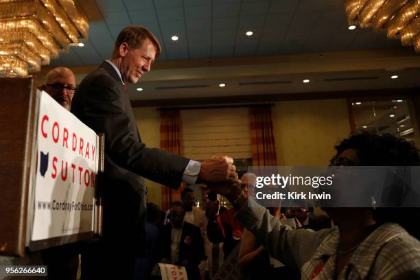 Democratic Gubernatorial candidate Richard Cordray shakes hands with supporters after speaking during a primary night event on May 8, 2018 in...