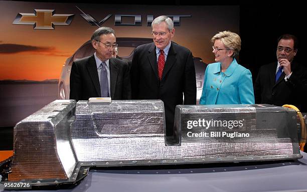 Secretary of Energy Steven Chu , General Motors Chairman and CEO Ed Whitacre , and Michigan Governor Jennifer Granholm pose with the first battery...