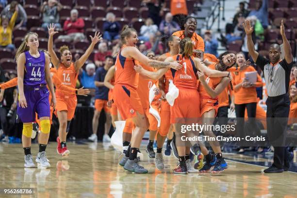 May 7: Rachel Banham of the Connecticut Sun is congratulated by team mates after her long range buzzer beater won the game as Karlie Samuelson of the...