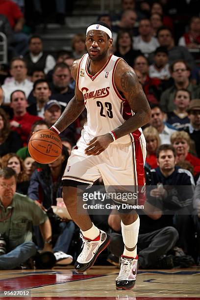 LeBron James of the Cleveland Cavaliers moves the ball up court during the game against the Milwaukee Bucks on December 18, 2009 at Quicken Loans...