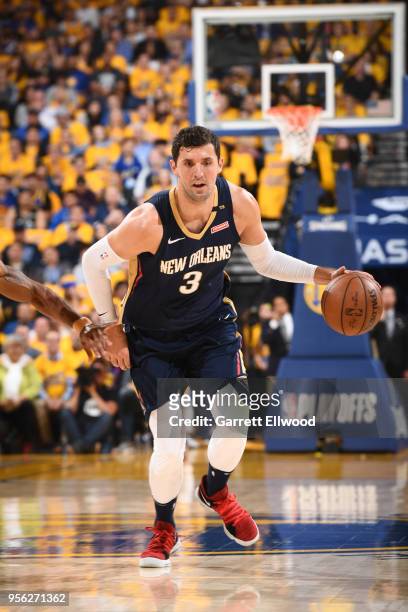 Omer Asik of the New Orleans Pelicans handles the ball against the Golden State Warriors in Game Five of the Western Conference Semifinals of the...