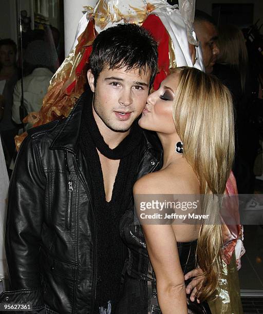 Actors Cody Longo and Cassie Scerbo arrive at the Famous Cupcakes Beverly Hills grand Opening hosted by the Kardashian Family on October 7, 2009 in...