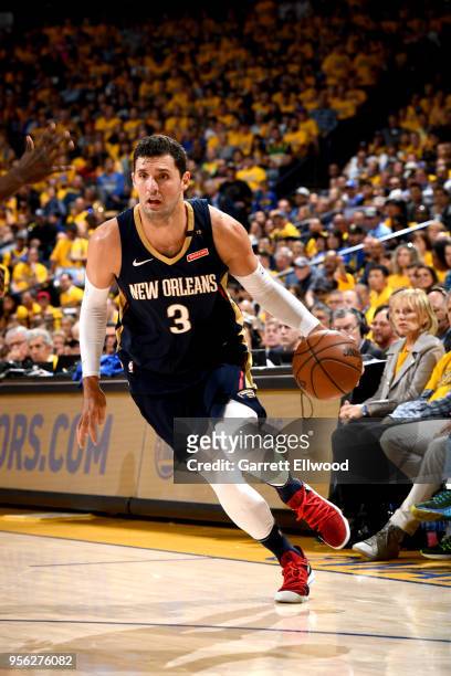 Omer Asik of the New Orleans Pelicans handles the ball against the Golden State Warriors in Game Five of the Western Conference Semifinals of the...