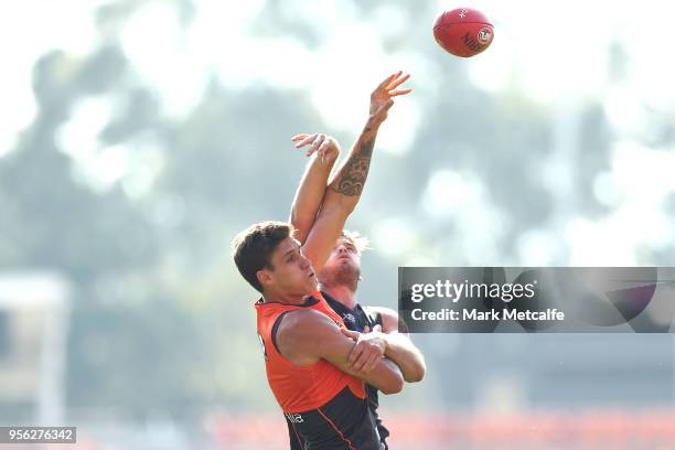 Matthew Flynn of the Giants and Rory Lobb of the Giants compete for the ball during a Greater Western Sydney Giants AFL training session at Spotless...