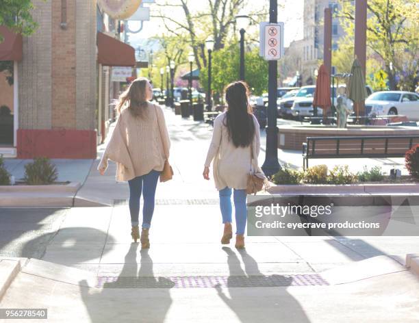 happiness - spring evening in the city young adult college age female best friends - small town america stock pictures, royalty-free photos & images
