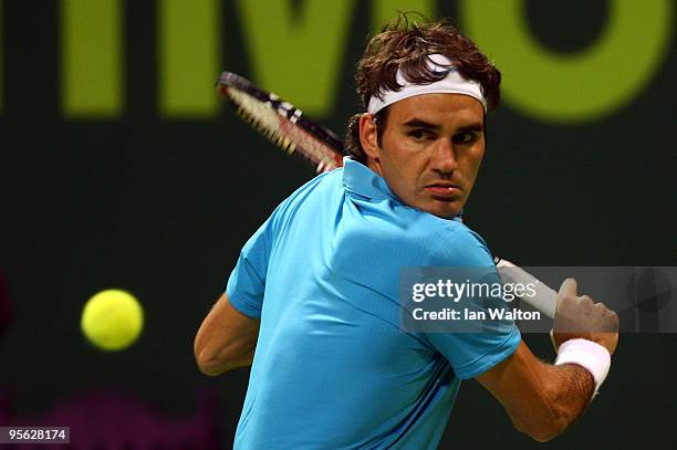 Roger Federer of Switzerland in action against Ernests Gulbis of Latvia during the quarter final match of the ATP Qatar ExxonMobil Open at the...