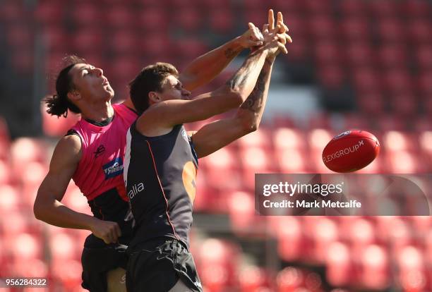 Jake Stein of the Giants and Rory Lobb of the Giants compete for the ball during a Greater Western Sydney Giants AFL training session at Spotless...