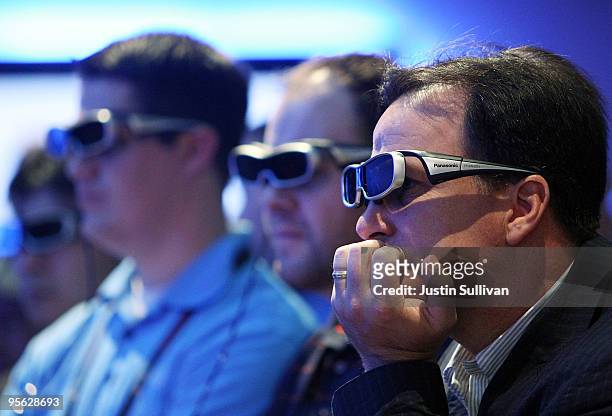 Attendees wear 3-D glasses as they watch a 3-D television in the Panasonic booth at the 2010 International Consumer Electronics Show at the Las Vegas...