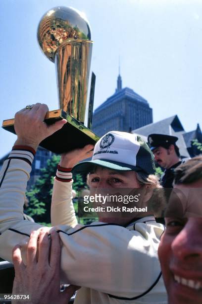 Larry Bird of the Boston Celtics holds the championship trophy over his head during their 1981 Championship parade in Boston, Massachusetts. NOTE TO...