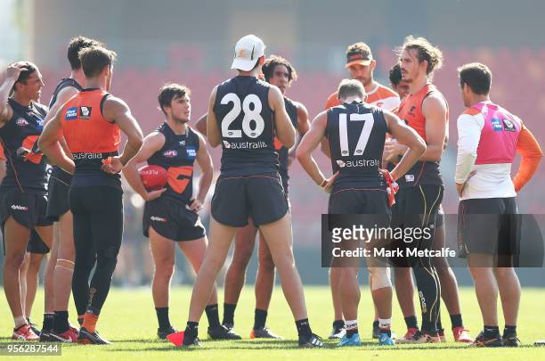 Phil Davis of the Giants talks to team mates during a Greater Western Sydney Giants AFL training session at Spotless Stadium on May 9, 2018 in...