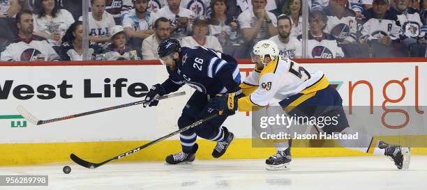 Blake Wheeler of the Winnipeg Jets takes on Roman Josi of the Nashville Predators in Game Six of the Western Conference Second Round during the 2018...