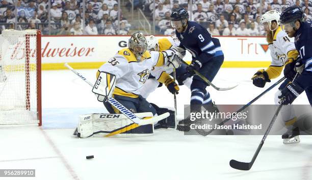 Pekka Rinne of the Nashville Predators makes a save against Andrew Copp of the Winnipeg Jets in Game Six of the Western Conference Second Round...