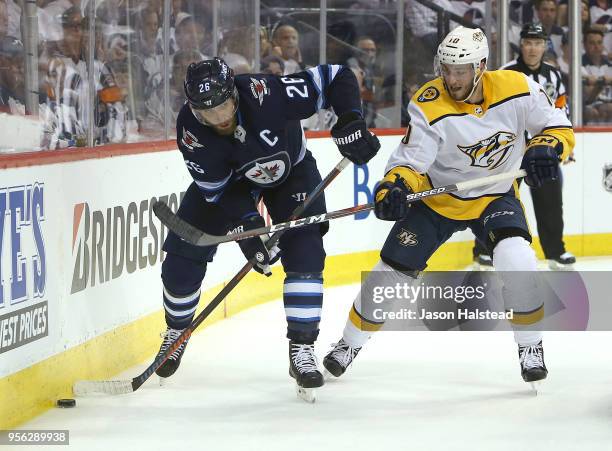 Blake Wheeler of the Winnipeg Jets battles behind the net with Colton Sissons of the Nashville Predators in Game Six of the Western Conference Second...