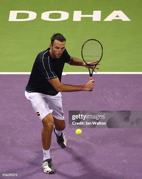 Ivo Karlovic of Croatia in action against Nikolay Davydenko of Russia during the quarter final match of the ATP Qatar ExxonMobil Open at the Khalifa...