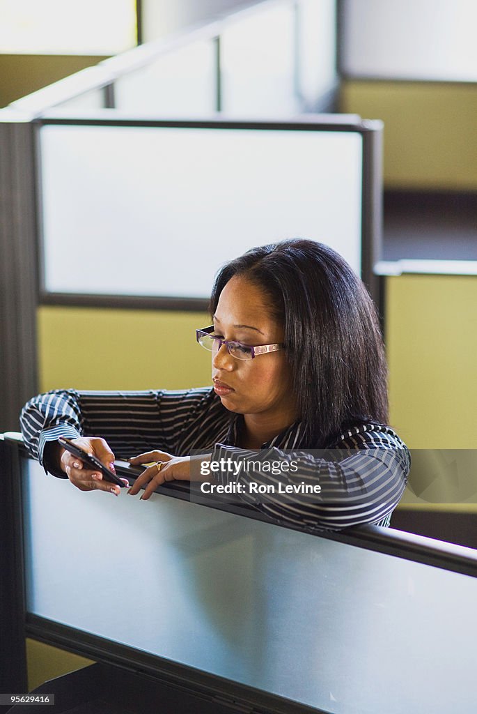 Executive reading e-mails on pda device