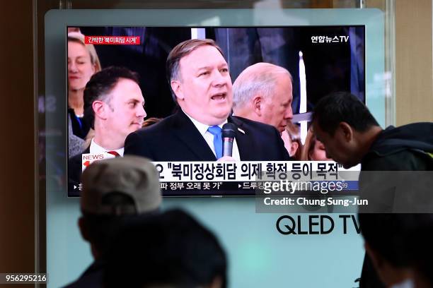 South Koreans watch on a screen reporting the U.S. Secretary of State Mike Pompeo visit to North Korea at the Seoul Railway Station on May 9, 2018 in...