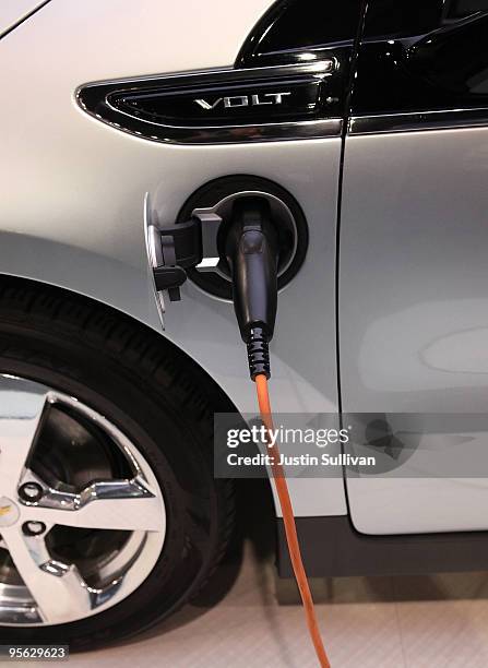 An electrical cord is plugged into a Chevy Volt at the 2010 International Consumer Electronics Show at the Las Vegas Hilton January 7, 2010 in Las...