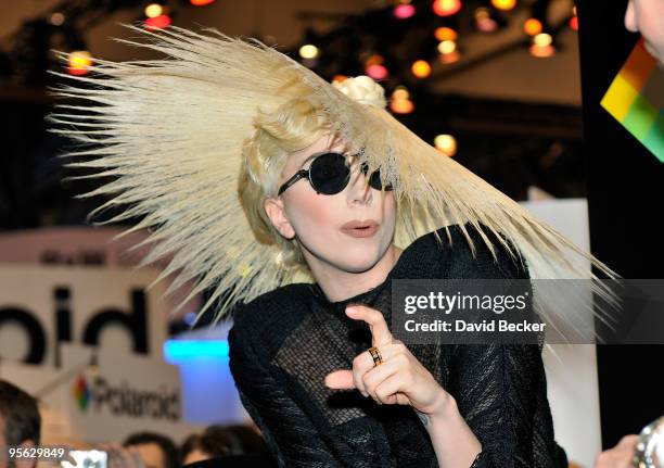 Singer Lady Gaga gestures during an announcement of her long term partnership with Polaroid as the brand's creative director on a specialty line of...