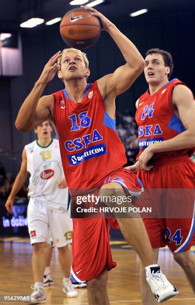 Anton Ponkrashov of CSKA tries to score in front of Gasper Vidmar of Olimpija during their Euroleague basketball match in Ljubljana, on January 7,...