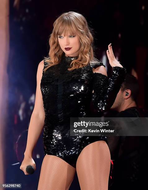 Taylor Swift performs onstage during opening night of her 2018 Reputation Stadium Tour at University of Phoenix Stadium on May 8, 2018 in Glendale,...