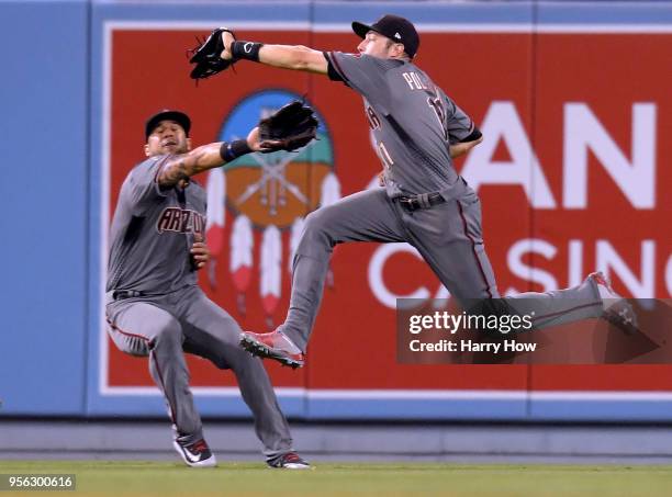 Pollock of the Arizona Diamondbacks makes a running catch in front of David Peralta, for an out of Chris Taylor of the Los Angeles Dodgers to end the...