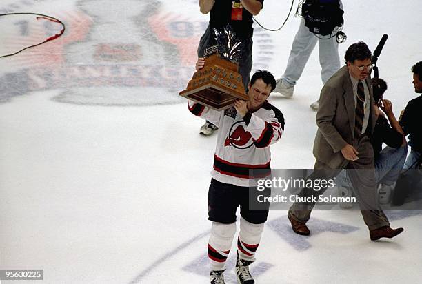 New Jersey Devils Claude Lemieux victorious with Conn Smythe trophy after winning Game 4 and series vs Detroit Red Wings. East Rutherford, NJ...