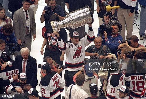 New Jersey Devils Claude Lemieux victorious with Stanley Cup trophy after winning Game 4 and series vs Detroit Red Wings. East Rutherford, NJ...