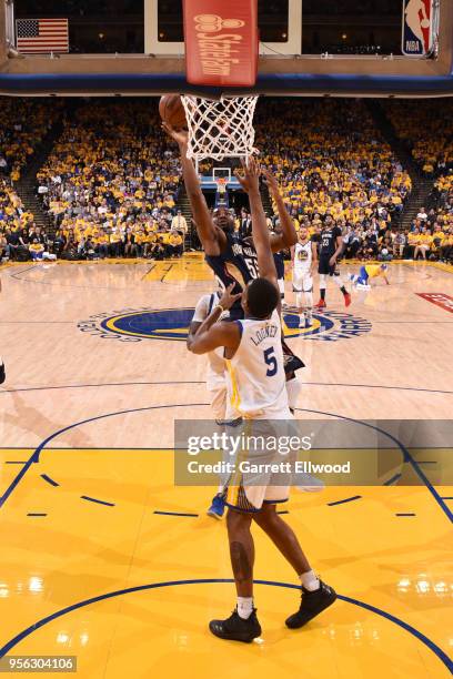 Twaun Moore of the New Orleans Pelicans goes to the basket against the Golden State Warriors in Game Five of the Western Conference Semifinals of the...