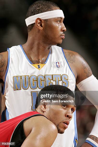 Carmelo Anthony of the Denver Nuggets and Brandon Roy of the Portland Trail Blazers take a break from the action during the game on December 25, 2009...