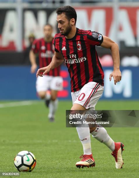 Hakan Calhanoglu of AC Milan in action during the serie A match between AC Milan and Hellas Verona FC at Stadio Giuseppe Meazza on May 5, 2018 in...