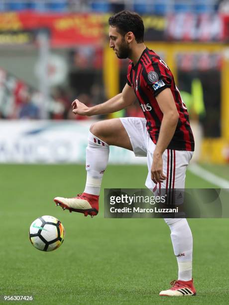 Hakan Calhanoglu of AC Milan in action during the serie A match between AC Milan and Hellas Verona FC at Stadio Giuseppe Meazza on May 5, 2018 in...
