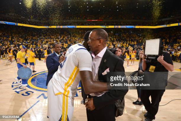 Draymond Green of the Golden State Warriors and Head Coach Alvin Gentry of the New Orleans Pelicans hug after Game Five of the Western Conference...