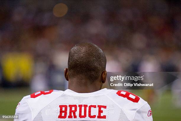 Isaac Bruce of the San Francisco 49ers watches the action from the sidelines during the game against the St. Louis Rams at the Edward Jones Dome on...