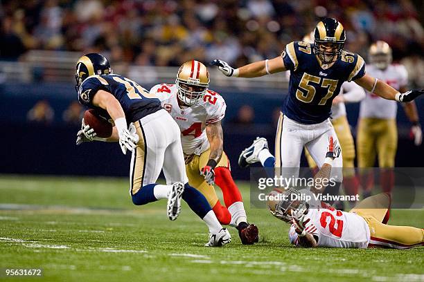 Michael Robinson of the San Francisco 49ers moves to tackle Danny Amendola of the St. Louis Rams at the Edward Jones Dome on January 3, 2010 in St....