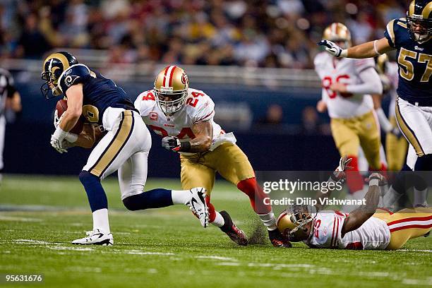 Michael Robinson of the San Francisco 49ers moves to tackle Danny Amendola of the St. Louis Rams at the Edward Jones Dome on January 3, 2010 in St....